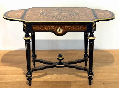 a small table with a wooden top on a hard wood floor