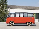a red and black vw bus parked in front of a building