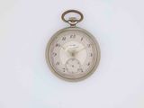 a silver pocket watch on a white surface