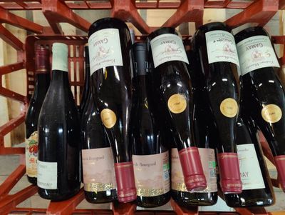 many bottles of wine sitting in a wine rack