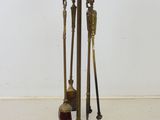 an image of a set of three metal tools sitting on top of a white floor