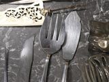 a tray with silverware and silverware on a table