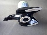 a black and white bird figurine sitting on a table