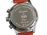 a close up of a watch on a white background