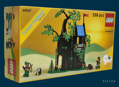 une boîte contenant un château en Lego, sur fond bleu