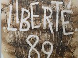a sign that says lubertte 89 on the side of a building