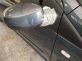 an image of a car door mirror with a piece of tin foil on it