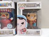 two boxes of funko pop vinyl figures are on a table