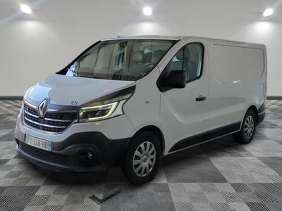 the white van is parked on a checkered floor in a room