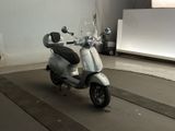 a scooter that is parked in a garage