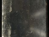 a small mirror that is on a black surface