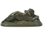 bronze sculpture of a woman laying on her back on a green base