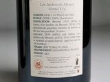 a bottle of wine sitting on a table with a label on it