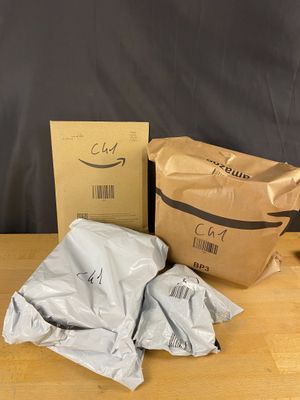 two bags of food sitting on top of a table next to a bag of food