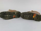 two pairs of brown shoes with orange tags on them on a white surface