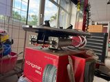 a machine that is sitting on a cart in a garage