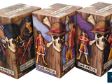 three boxes of one piece figurines on a white background