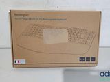 boxed box of a computer keyboard sitting on top of a table