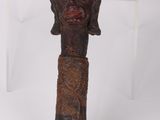 an image of a wooden stick with a face on top of it