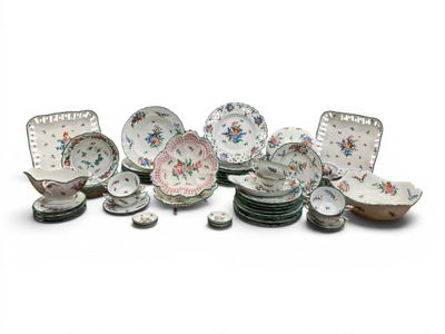a lot of plates and bowls sitting on a table
