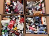 two boxes filled with different types of cosmetics and toothbrushes