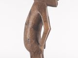 an image of a wooden statue of a rabbit standing on its hind legs