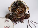 a purse and a plate on a white table