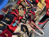 a pile of old military uniforms on a table