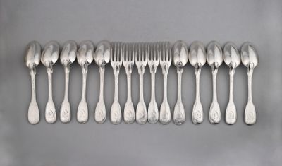 a lot of silver spoons and forks on the table