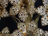 a close up picture of a bunch of flowers with crystals