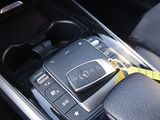 a cell phone sitting in the center console of a car