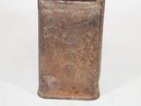 a small metal container with a lid on a white surface