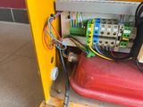 a machine that has a bunch of wires on the back of it
