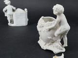 two figurines that are sitting on a table