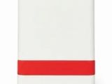 un gros plan sur un cahier blanc et rouge orné d'une bande rouge