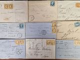 several old envelopes are stacked on top of each other on a table