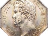 an image of a silver coin with a portrait of a man on it