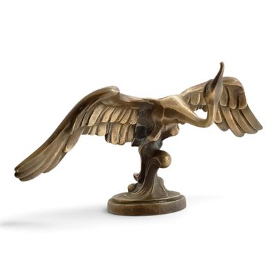 bronze statue of a bird on a branch on a white background