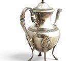 a silver tea pot on a stand on a white background