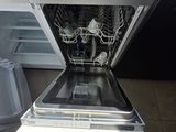a dishwasher that is open in a kitchen