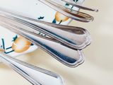 a lot of spoons that are on a plate
