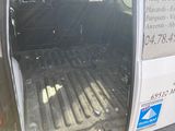 a white van with the door open on the side of the road
