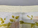 a close up of a piece of fabric with a rose on it