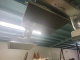 a ceiling fan that is hanging from the ceiling in a room