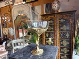 a glass bowl sitting on top of a table in a room