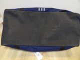 a black and blue bag sitting on a wooden floor