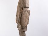wooden statue of a man with a hat on a white background