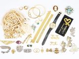 many different types of jewelry on the table