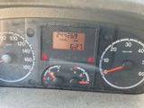 a close up of a car dashboard with a clock on it