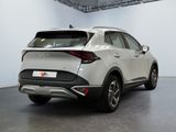 the rear end of a white suv parked in a garage